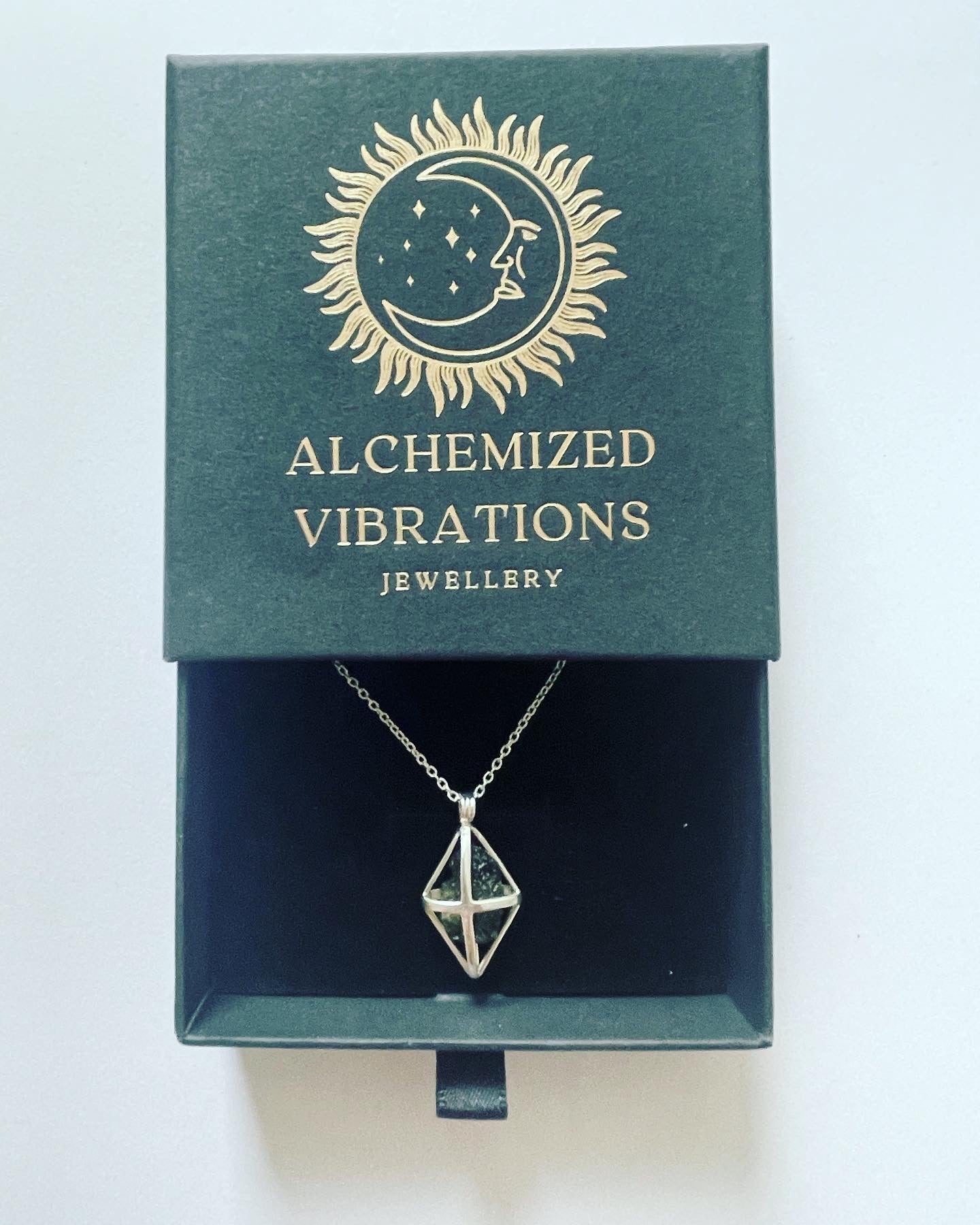 Moldavite cage pendant, set in pure sterling silver